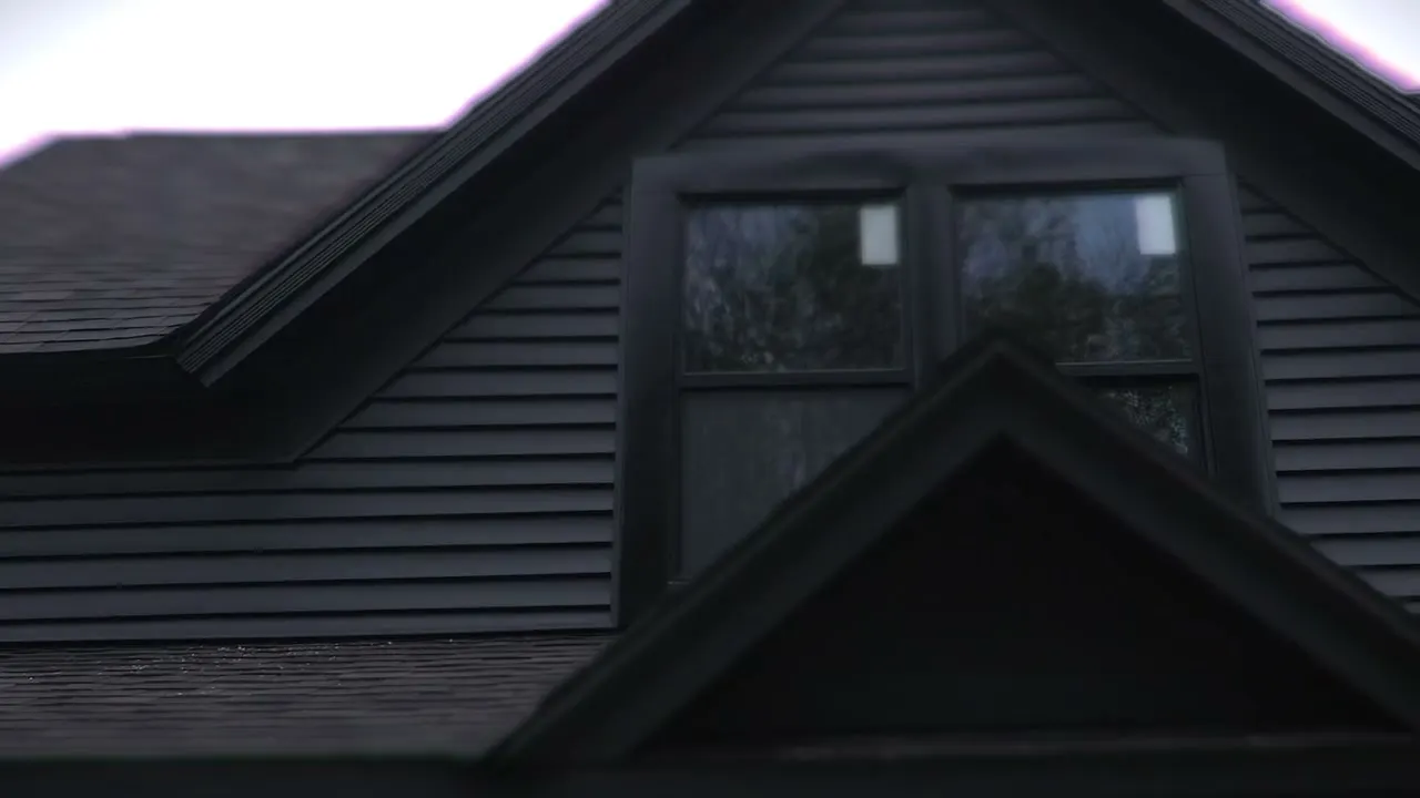 After: the dark gable over the rebuilt porch