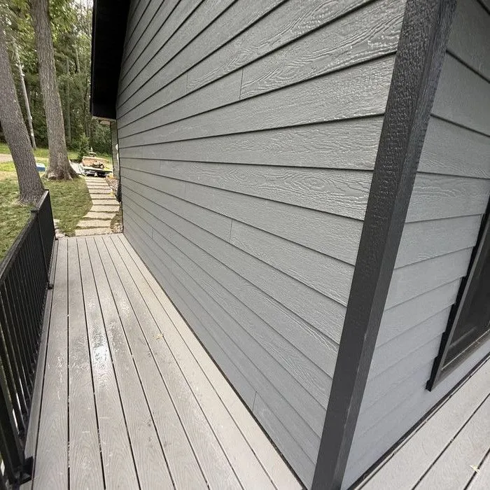 New siding meeting the deck along the back wall