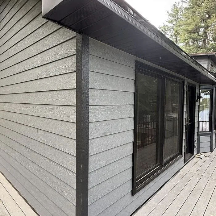 Sliding door and windows along the deck, trimmed in black