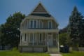 A Victorian house with a gabled front porch